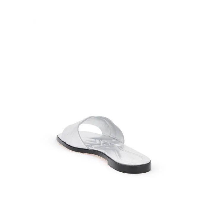 Alexander McQueen laminated leather slides with embossed seal logo