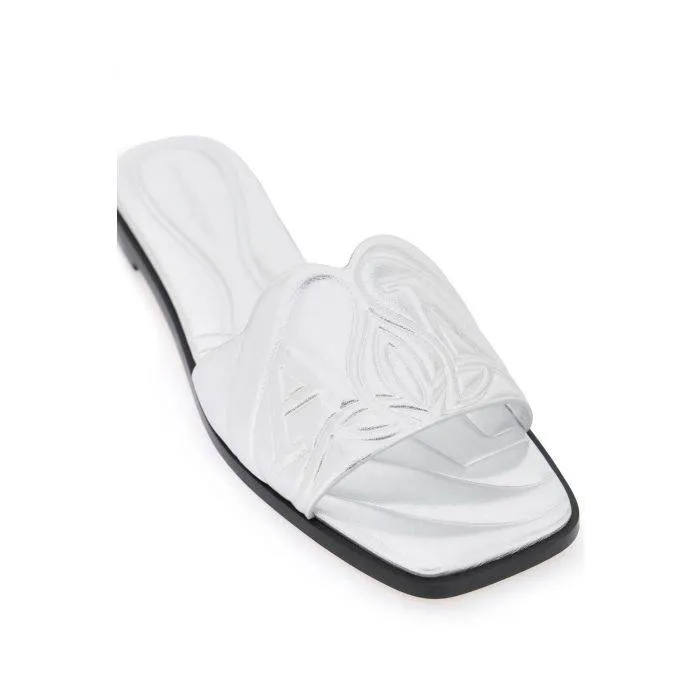 Alexander McQueen laminated leather slides with embossed seal logo